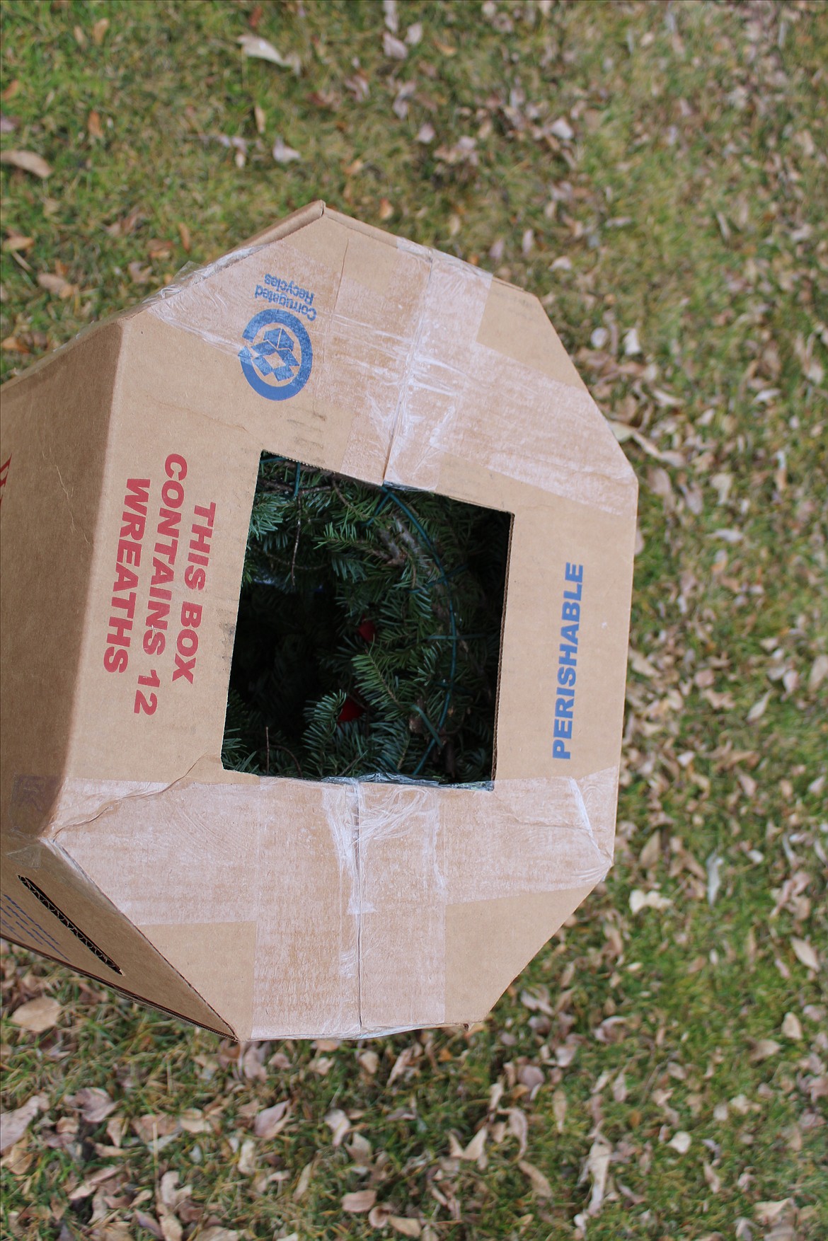 A box with a dozen remembrance wreaths set out for distribution of the wreaths during Saturday’s ceremonies. Individuals, families, classrooms and local organizations can sponsor a wreath through the Wreaths Across America organization.