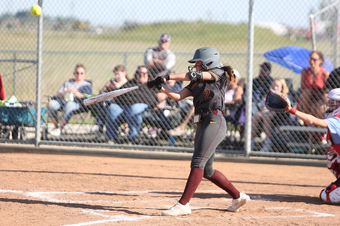 Moses Lake senior Raegen Hofheins (2) makes contact with a pitch during a game in the 2023 fastpitch softball season.