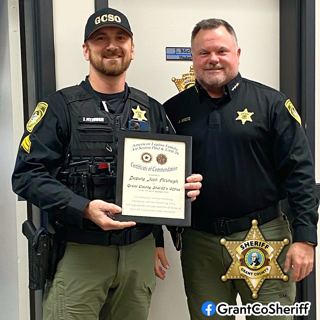 Grant County Sheriff Joe Kriete congratulates Corporal Josh Fitzhugh on his commendation from the Ephrata American Legion Art Semro Post 28 and Family Unit 28. Fitzhugh was recognized for his service and dedication to the community.