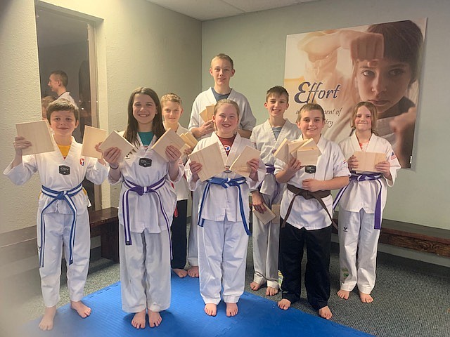 Intermediate/Advanced class. Front row, left to right, Finnegan Peterson (Blue Stripe), Faith Hughes (Purple Stripe), Addisyn Holland (Blue Stripe), Bing Dawson (Brown Belt), Daphne Pashell (Purple Stripe). Back row, left to right, Braden Burrows (Red Stripe), Hunter Burrows (Red Stripe), Rhys Hughes (Purple Stripe)