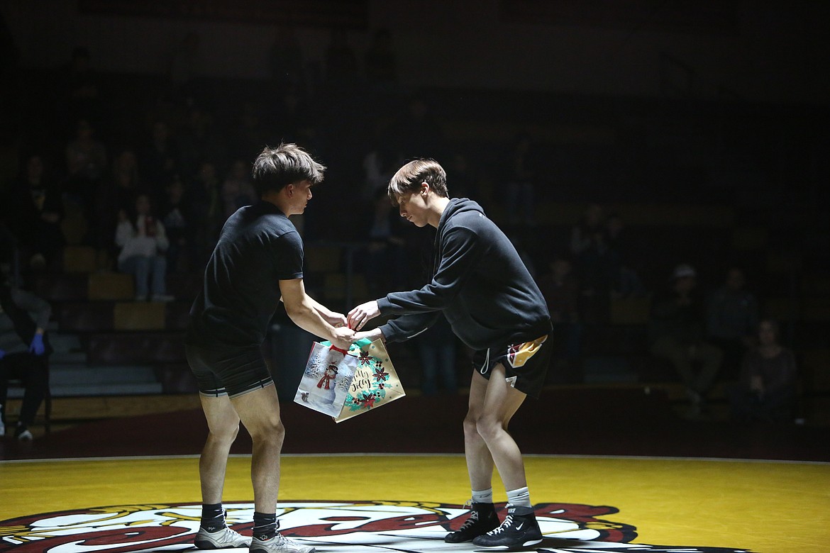 Wrestlers exchanged gifts during introductions before Wednesday’s dual began. Inside the gifts were t-shirts from each wrestler’s program.