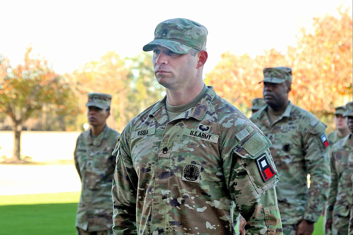 Staff Sgt. Adam Vissia, an all-wheel vehicle mechanic, assigned to Headquarters and Headquarters Company, 188th Infantry Brigade, prepares to receive an Army Commendation Medal during a brigade award ceremony on Fort Stewart at Cashe Garden, on Dec. 15.