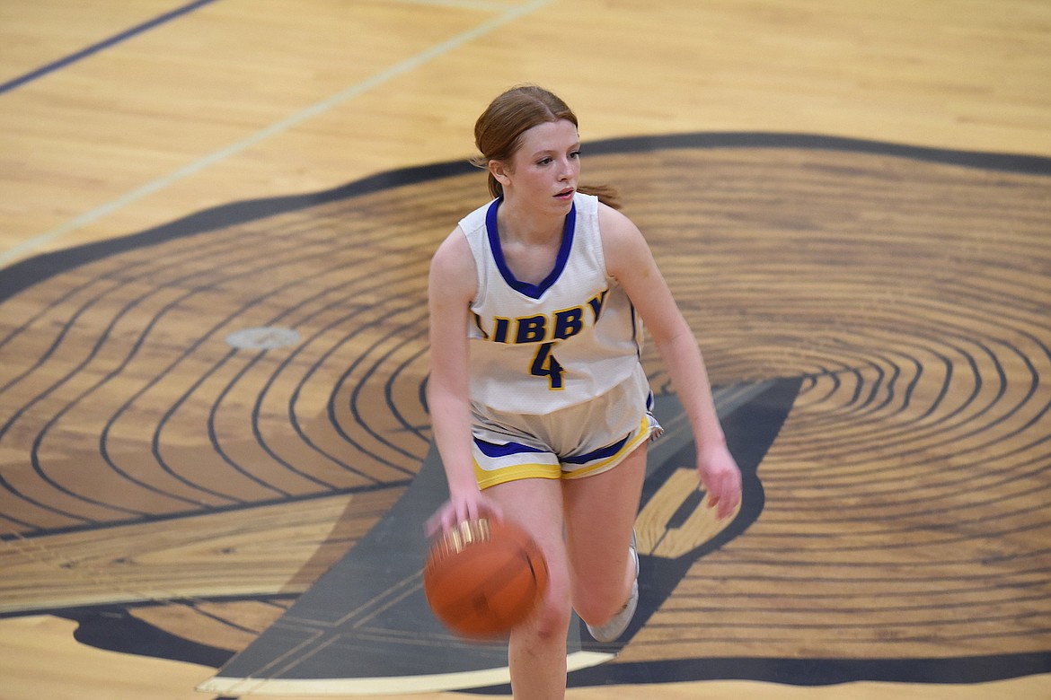 Libby's Ellie Andreessen brings the ball upcourt against Hamilton on Thursday, Dec. 21, 2023. (Scott Shindledecker/The Western News)