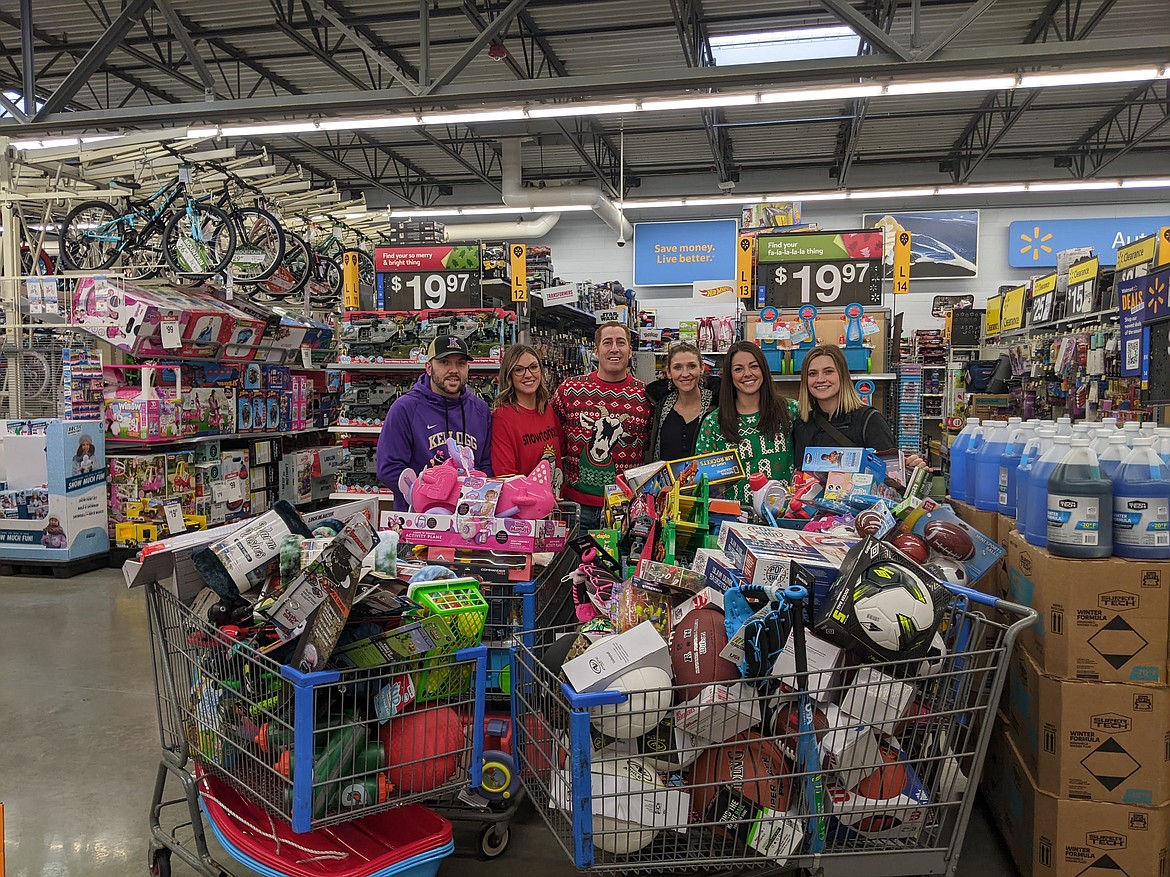 Travis Berti, Beth Carrico, Rick Luna, Loralee Visintainer, Gretchen Mann, and Marley Chambers stand with toys for kids in need. NASCO's Kellogg location was able to donate nearly $4,000 worth of toys, sporting goods, bikes, helmets, and sleds to Toys for Tots.