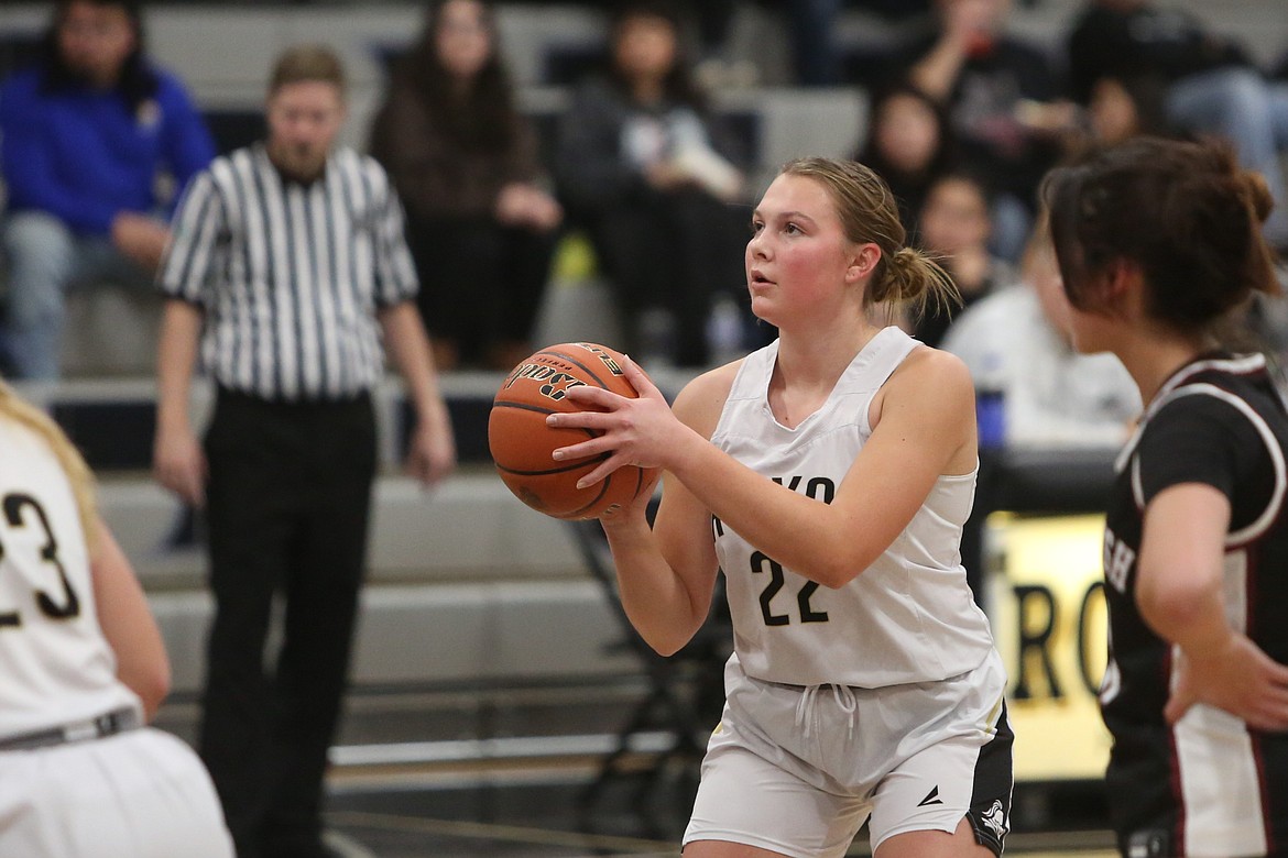 Royal senior Raegan Wardenaar (15) dribbles the ball up the floor against Toppenish.