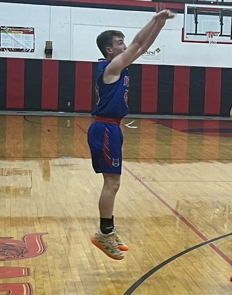 Superior freshman guard Gannon Quinlan goes up for two of his game high 22 points during the Bobcats win over Darby Thursday night in Darby. (Photo by Bryon Quinlan)