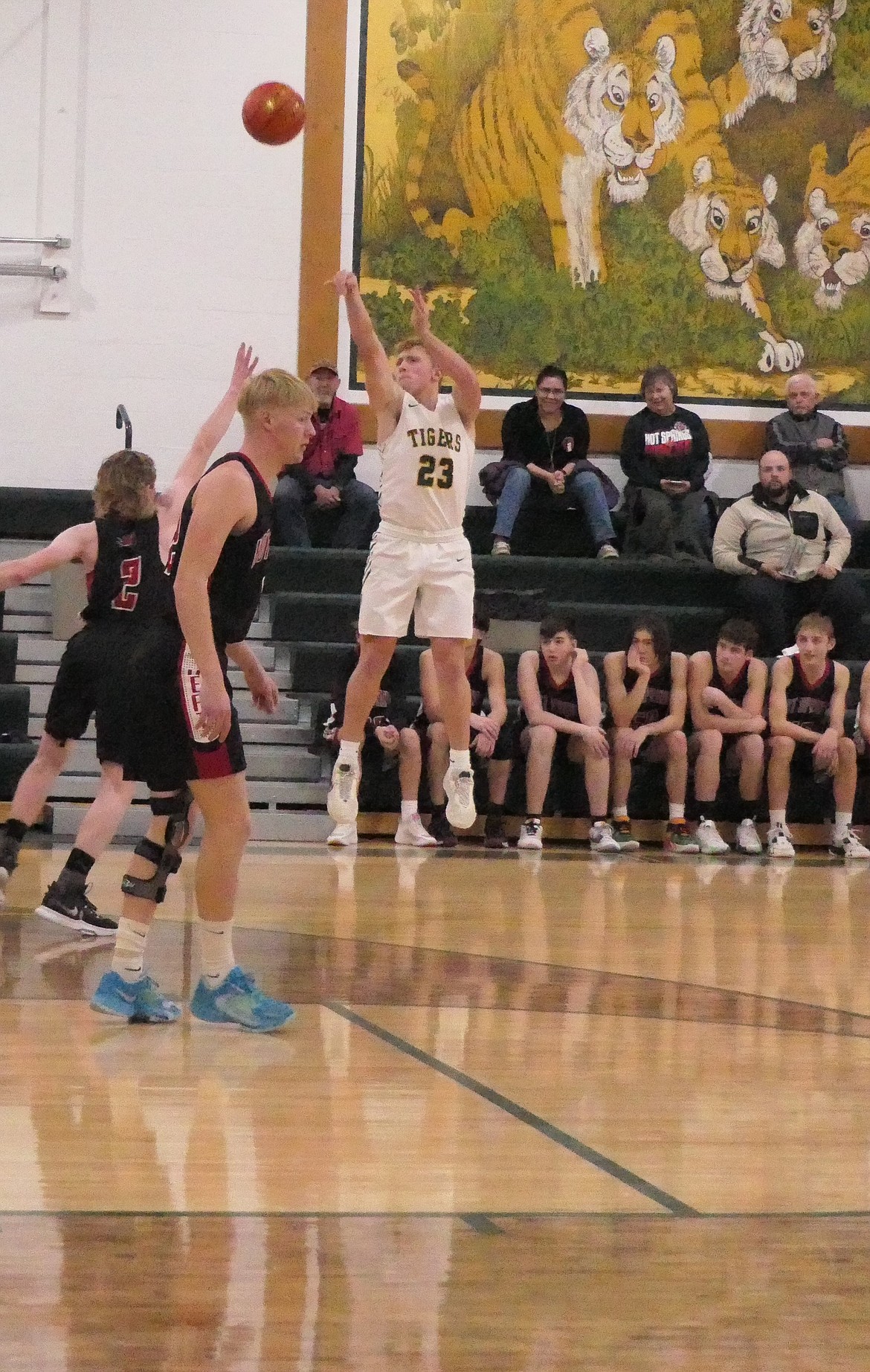 Tigers senior forward John Pruitt lofts a long three-pointer during St. Regis' 48-30 win over Hot Springs. (Chuck Bandel/VP-MI)