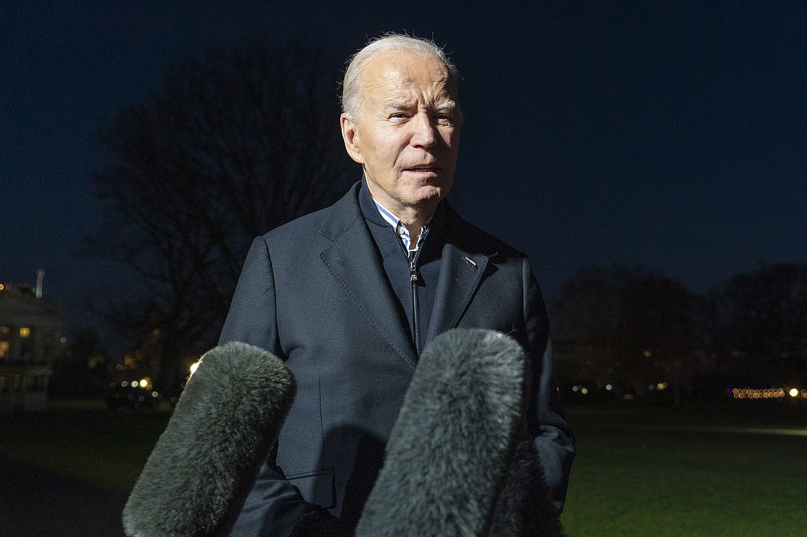 President Joe Biden answers a reporter's question as he walks from Marine One upon arrival on the South Lawn of the White House, Dec. 20, 2023, in Washington. Biden ordered retaliatory strikes Monday, Dec. 25, against Iranian-backed militia groups after three U.S. servicemembers were injured in a drone attack in Northern Iraq. (AP Photo/Alex Brandon, File)