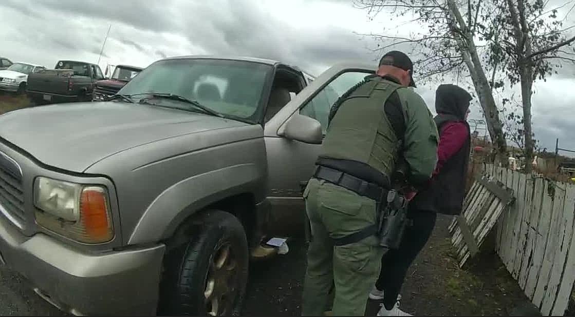 Tianna Gene Marie Trumble is cuffed during her arrest on December 6 for multiple charges after officers found her trespassing on a Ritzville-area property.