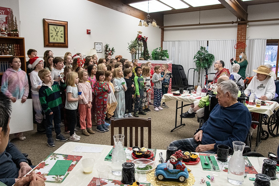 Mrs. Getts’s first grade class from Glacier Gateway Elementary carol for the veterans at Montana Veterans Home on Wednesday, Dec. 20. This was the first time the students were able to continue this tradition after the Covid-19 pandemic. (Avery Howe photo)