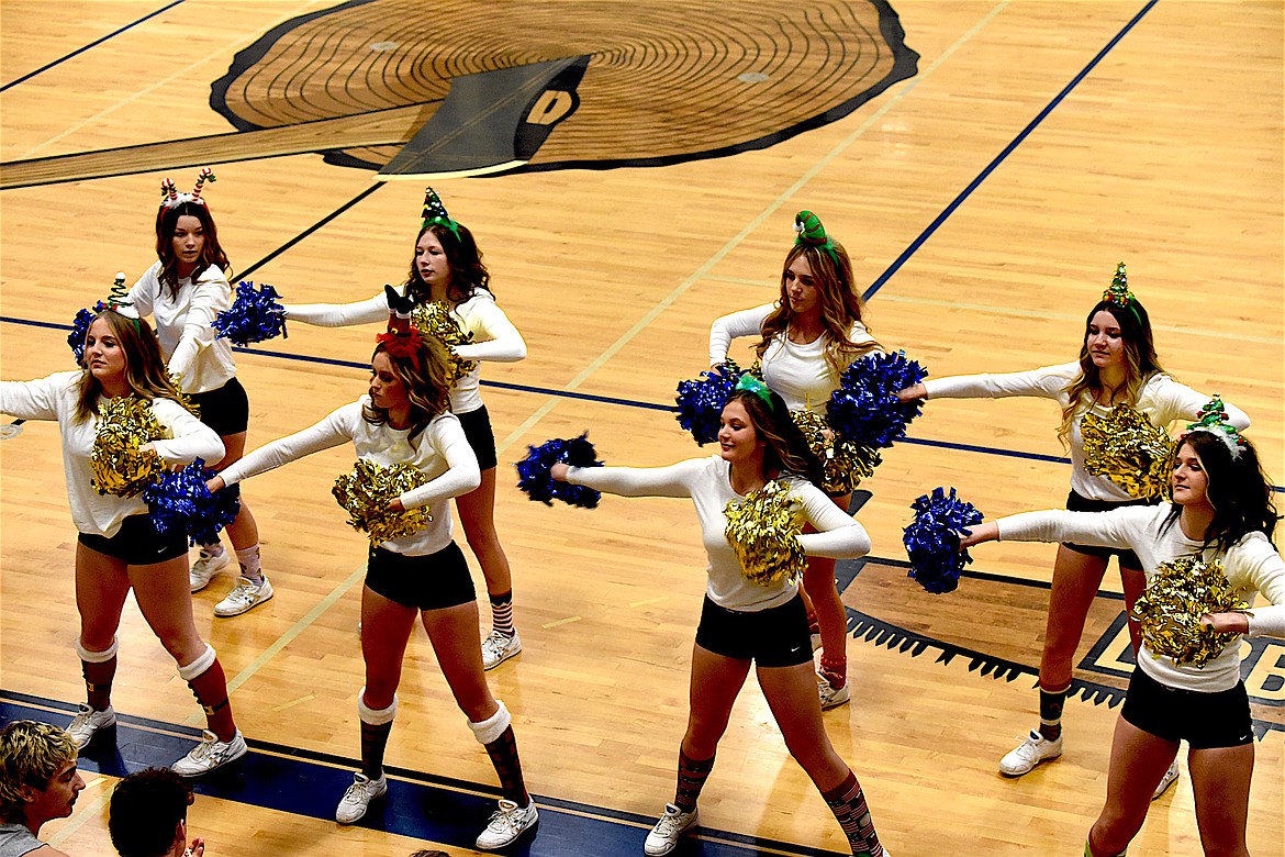 Libby's high school varsity cheer squad kept the fans entertained during the Dec. 22 games. (Scott Shindledecker/The Western News)