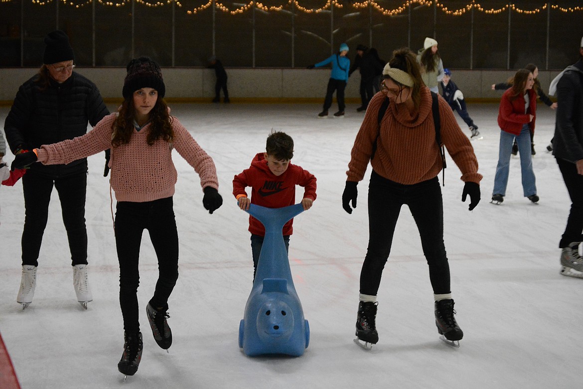 Spirit Lake residents Hunter Hill, Alanna Hill, and Sarah Hill go for a family skate day over winter break.