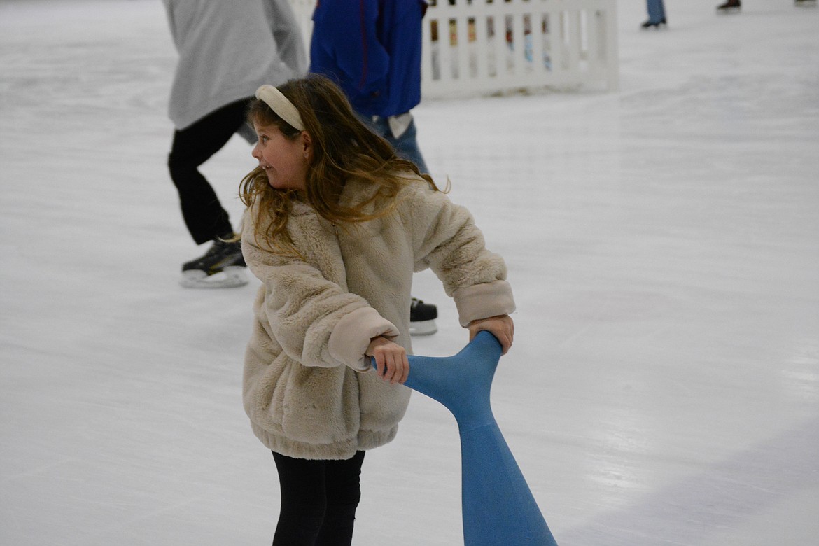 Alexis Jade turns to look for her family to share a moment of fun at Frontier Ice Arena.