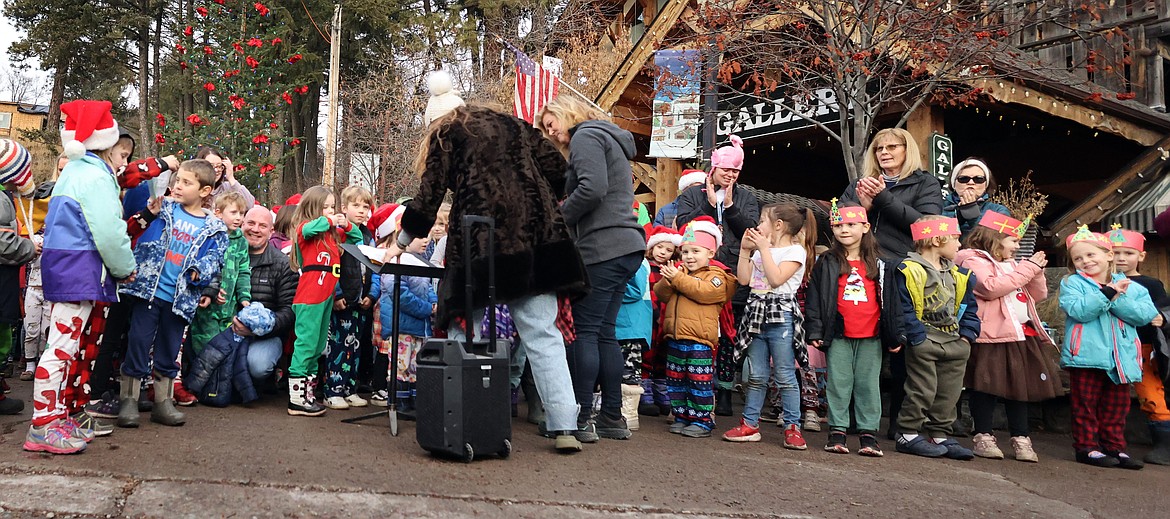 Bigfork Elementary students and teachers sing Christmas Carols at the downtown Christmas Tree Dec. 21, 2023. (Jeremy Weber/Bigfork Eagle)