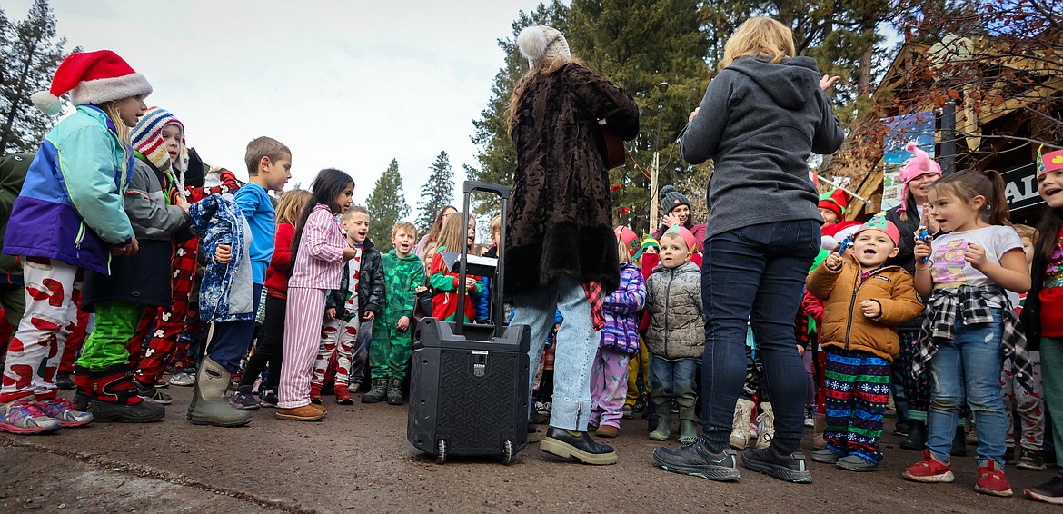 Bigfork Elementary students and teachers sing Christmas Carols at the downtown Christmas Tree Dec. 21, 2023. (Jeremy Weber/Bigfork Eagle)