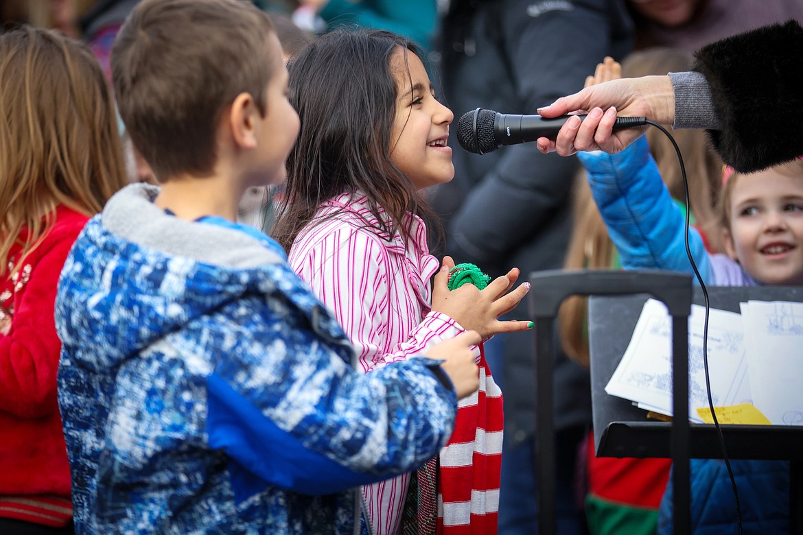 Bigfork Elementary students and teachers sing Christmas Carols at the downtown Christmas Tree Dec. 21, 2023. (Jeremy Weber/Bigfork Eagle)