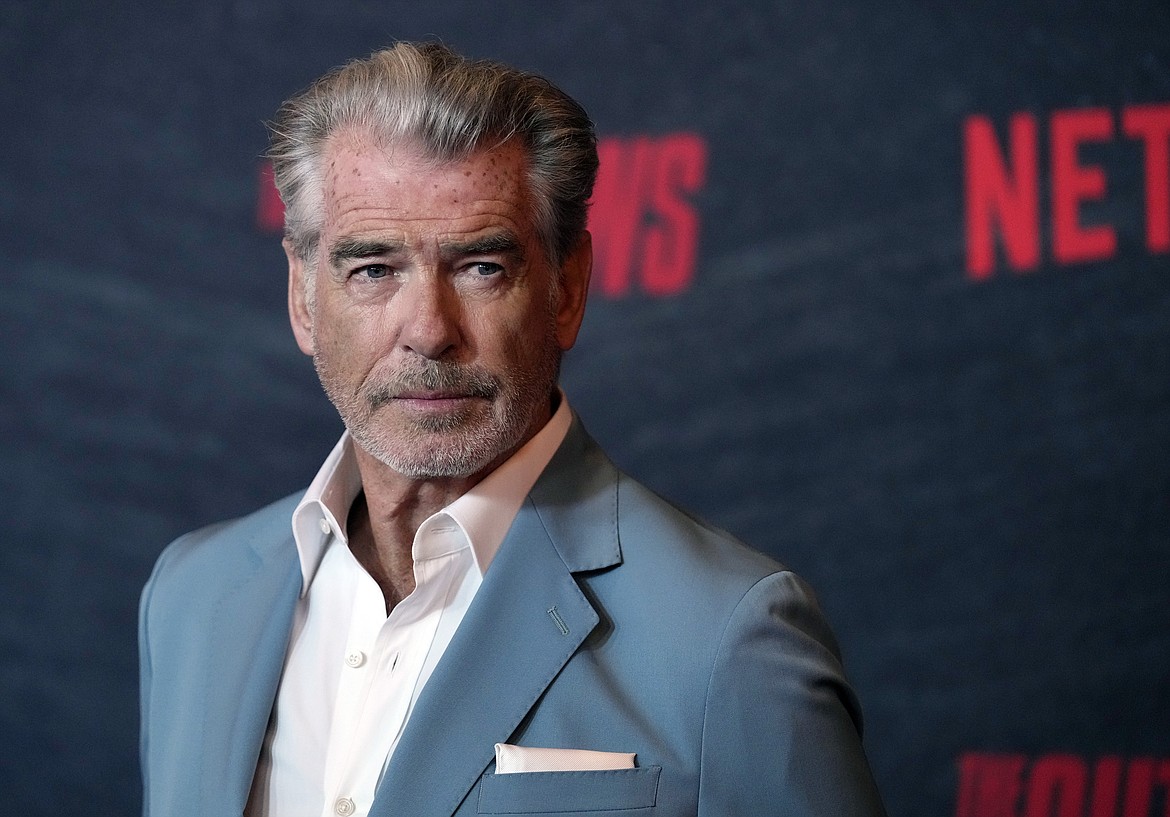 Pierce Brosnan, a cast member in "The Out-Laws," poses at a special screening of the film, Monday, June 26, 2023, at the Regal LA Live theaters in Los Angeles. Brosnan has been in hot water plenty of times as an actor playing the secret agent James Bond, though not in Yellowstone National Park. Now, for allegedly stepping out of bounds in a thermal area during a recent visit, Brosnan faces two citations and a court date in the world's oldest national park. (AP Photo/Chris Pizzello, File)