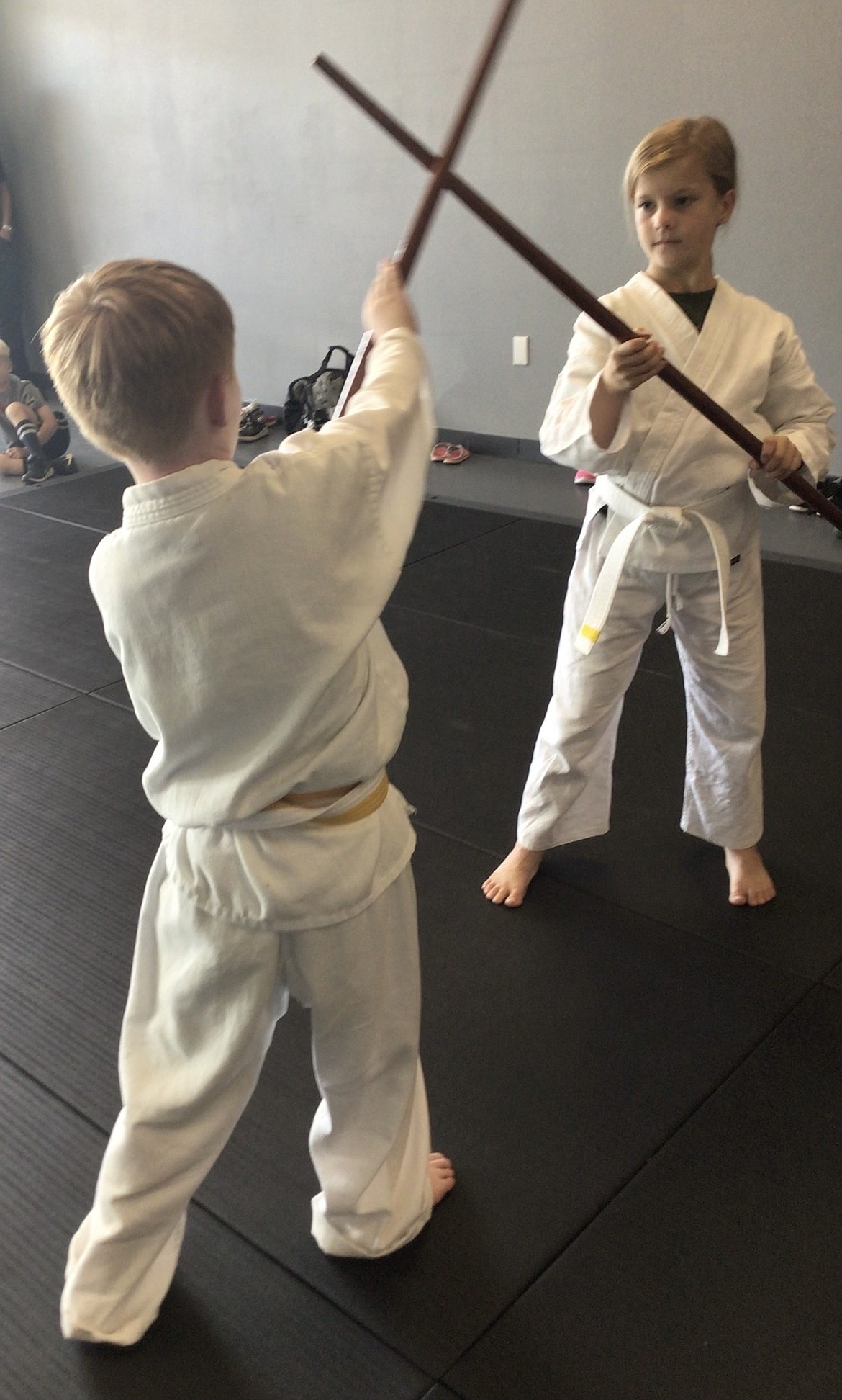 Students work with bo staffs during a class at Steel Wolf Karate. The dojo’s owner, Robert Heale, said martial arts is a passion that he enjoys sharing with his students, regardless of age.