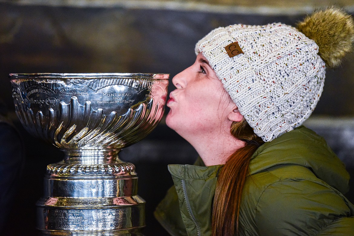 A fan kisses the Stanley Cup at Whitefish Mountain Resort's Base Lodge on Friday, Dec. 29. The trophy made a stop on Big Mountain as the defending NHL champion Vegas Golden Knights and Whitefish Mountain Resort are both owned by Foley Entertainment Group. (Casey Kreider/Daily Inter Lake)