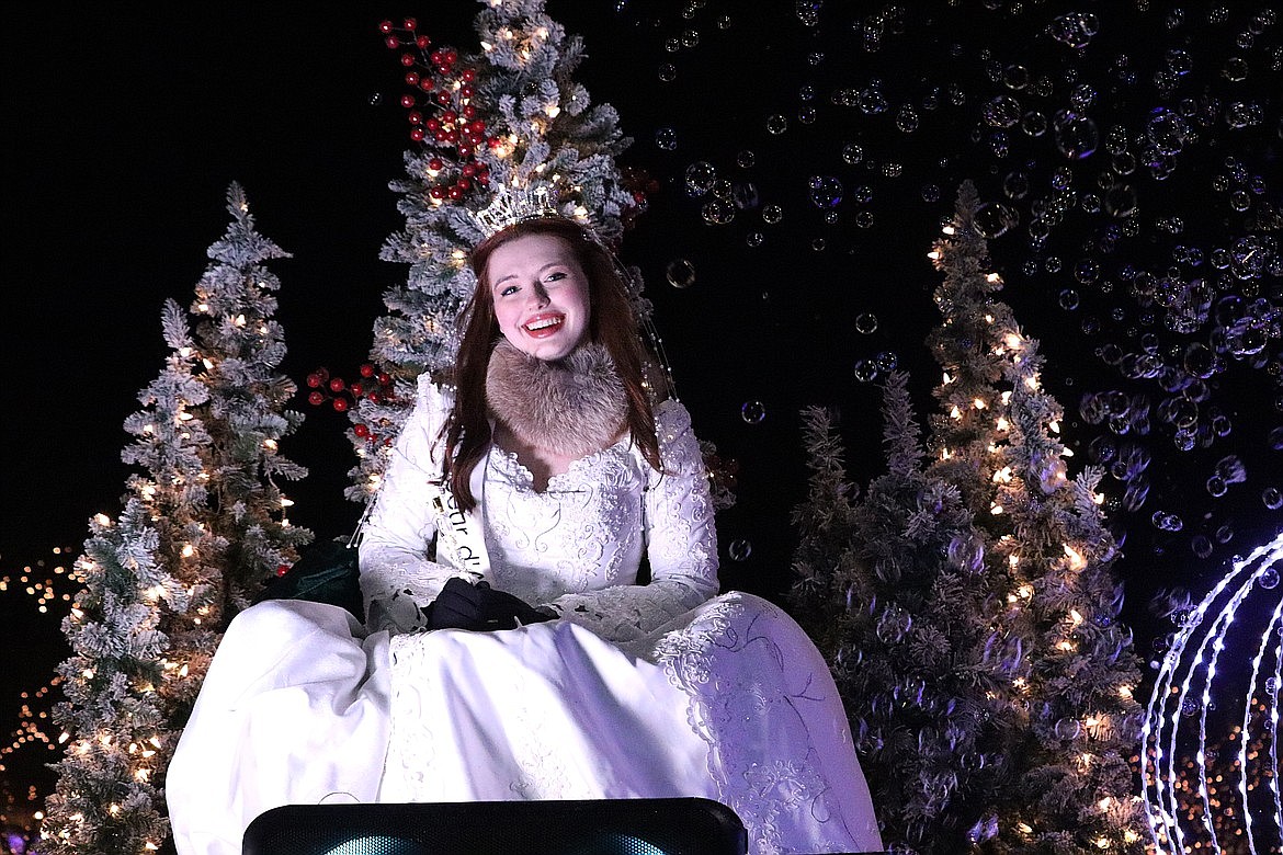 Juliet Hunt, Miss Coeur d'Alene's Teen, waves during the 31st annual Lighting Ceremony Parade in downtown Coeur d'Alene in November.