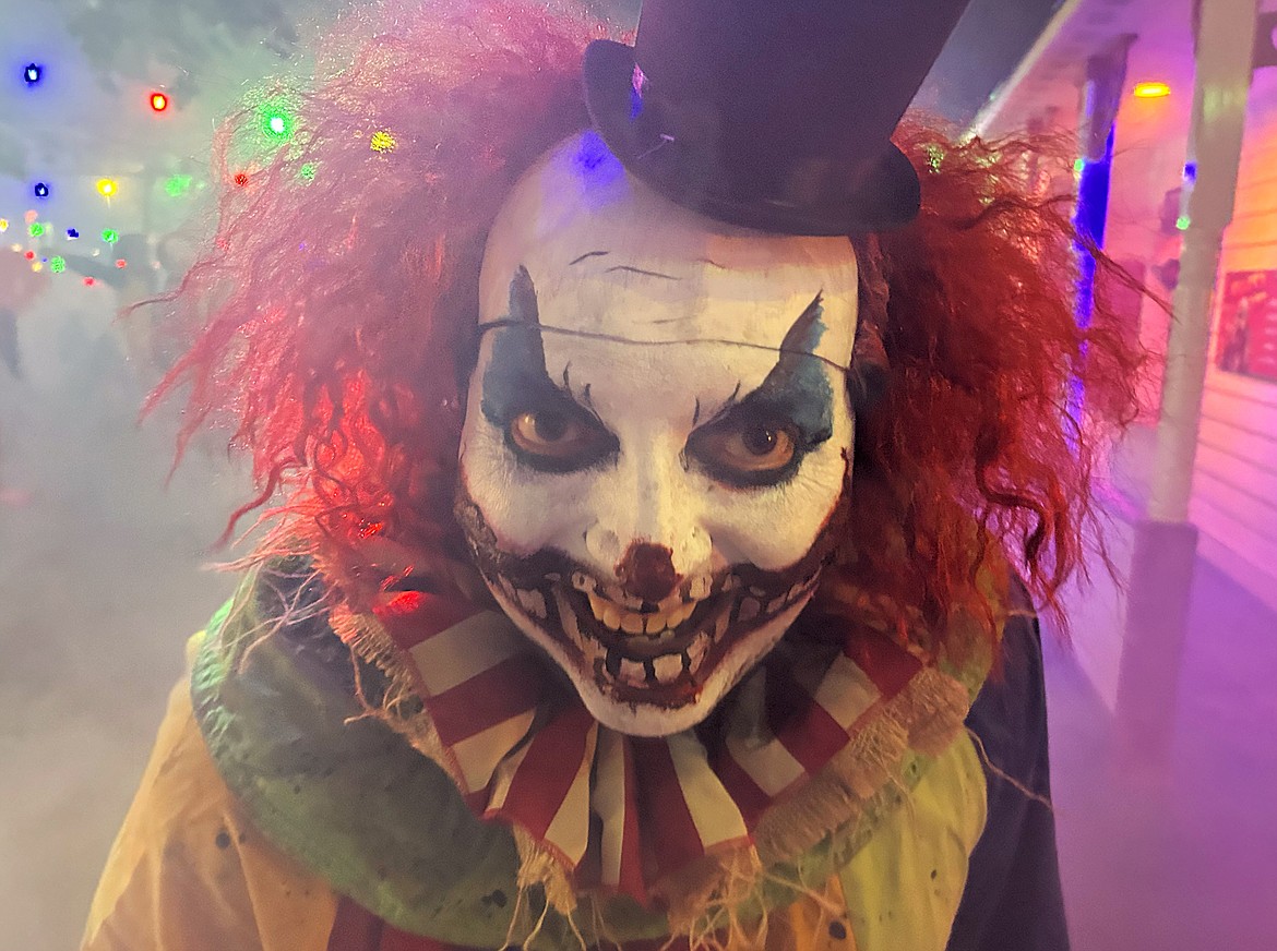 A clown is all smiles as he greets guests at Scarywood Theme Park in September.