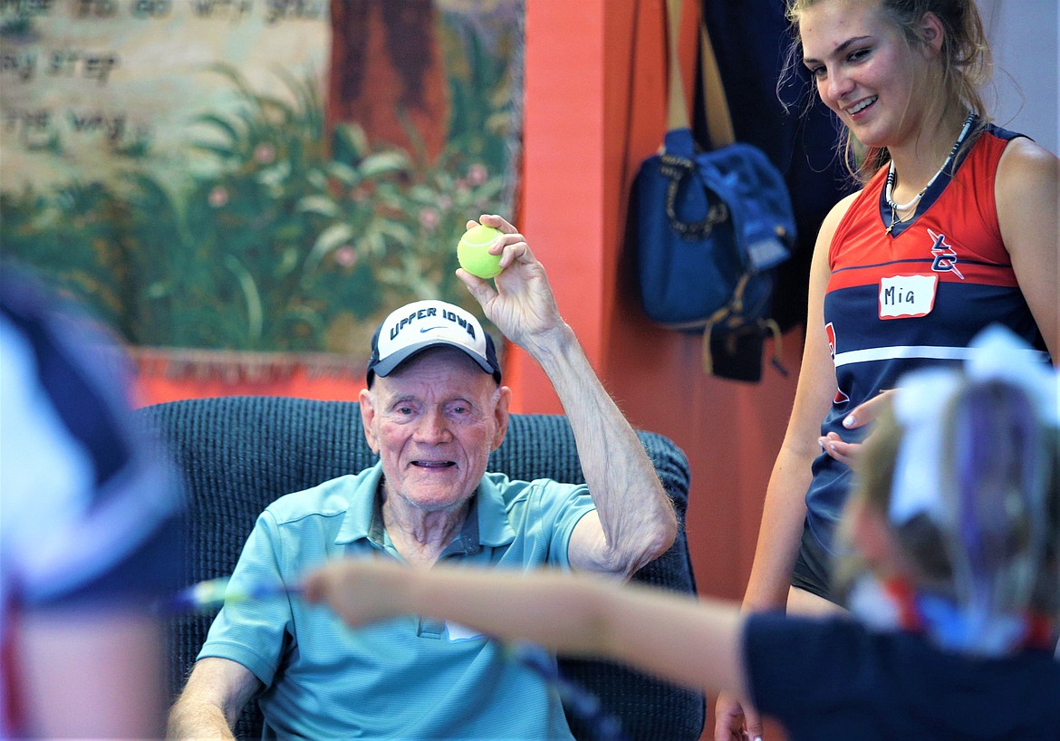 Don Dutton smiles as he plays a game with members of Lake City Thunder 14U softball team and their families at On Site for Seniors in Coeur d'Alene in June.