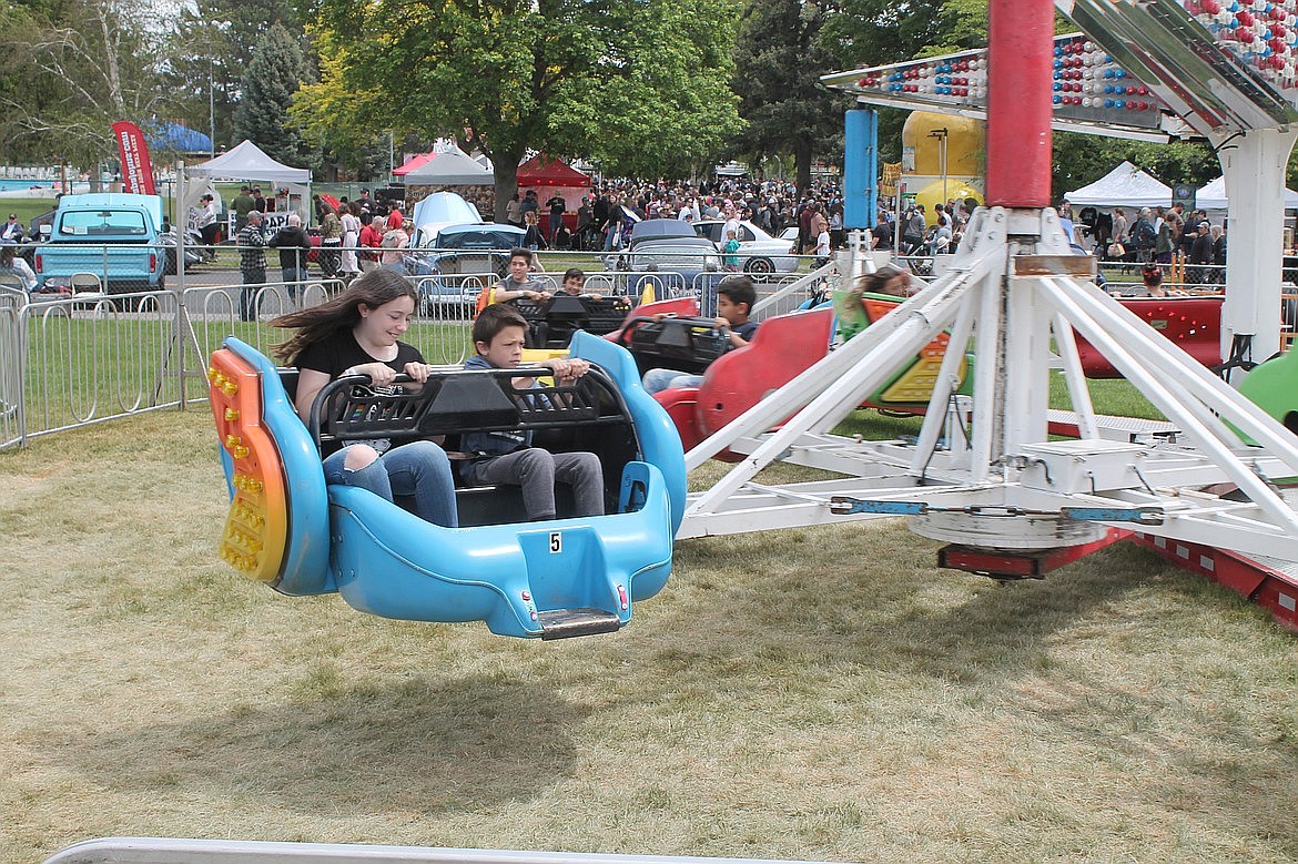 Carnival goers whirl on a carnival ride at the Moses Lake Spring Festival in the spring of 2022. The event was well attended after a two-year hiatus caused by the pandemic. This year’s event will be held May 23-26 at McCosh Park and will feature heavy metal acts Quiet Riot and Slaughter, according to the festival’s website.