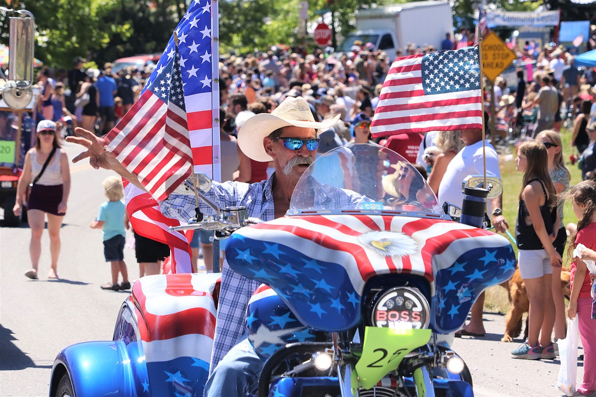 John Churchill's patriotism is on display as he rides through the Bayview Daze Fourth of July parade.