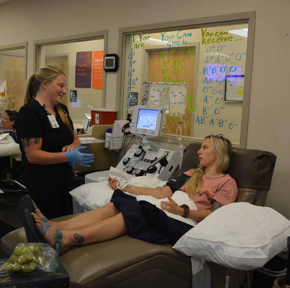 Phlebotomist Colbie Hayes prepares to obtain platelets from Zoie Cloutier at Vitalant. Blood supplies often dip during the summer months, when the need for donations often goes up, causing emergency need like the one that northern Idaho is currently undergoing.