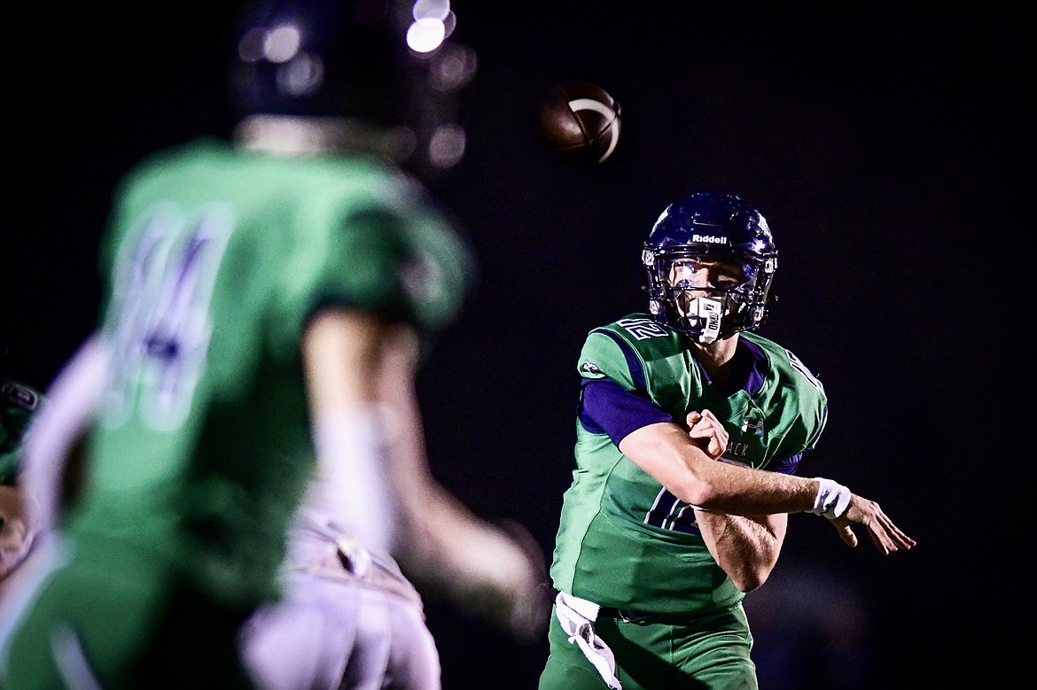 Glacier quarterback Jackson Presley (12) completes a 14-yard touchdown pass to tight end Van Scholten (14) in the second quarter against Helena Capital at Legends Stadium on Friday, Sept. 29. (Casey Kreider/Daily Inter Lake)