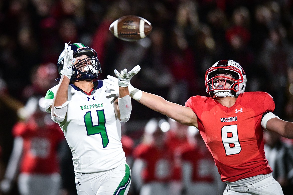 Glacier wide receiver Kole Johnson (4) holds on to a 33-yard reception in the second quarter against Bozeman in the Class AA state championship at Van Winkle Stadium on Friday, Nov. 17. (Casey Kreider/Daily Inter Lake)