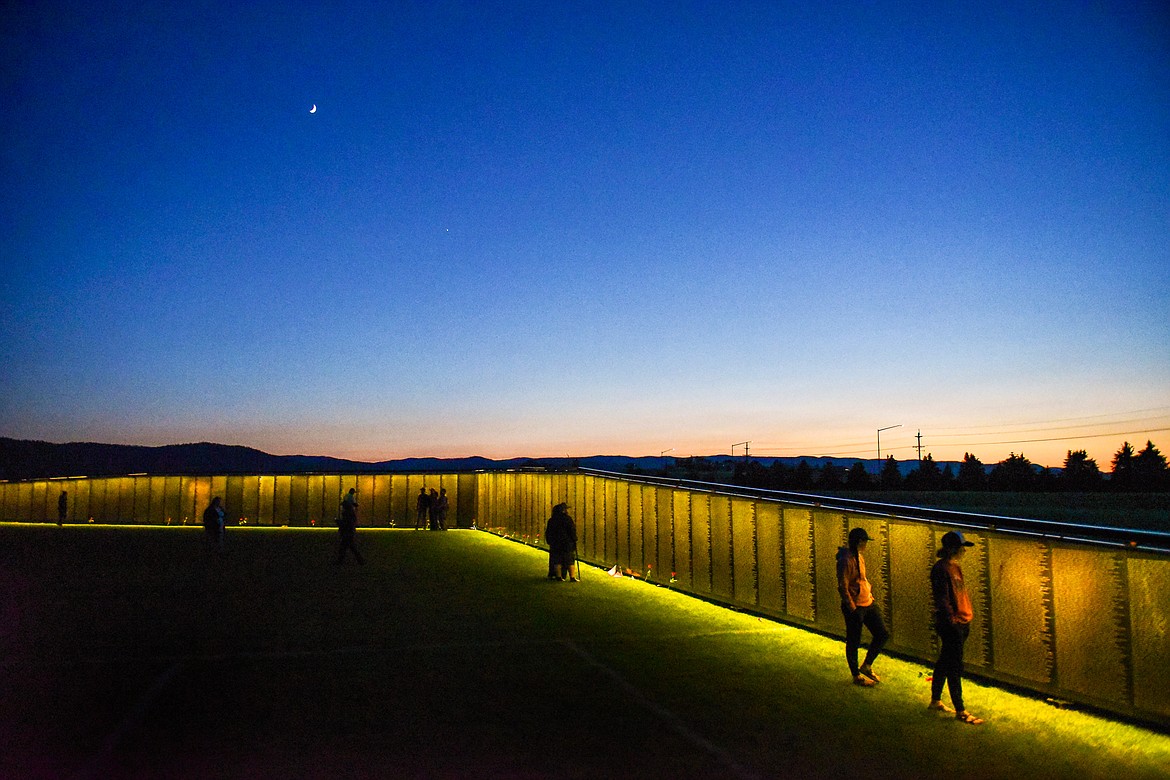 Visitors pay their respects at The Wall That Heals at the Glacier High School soccer fields on Thursday, June 22. (Casey Kreider/Daily Inter Lake)