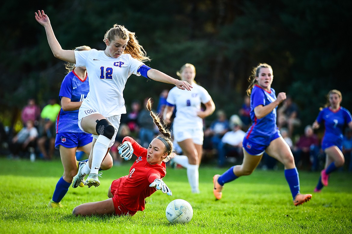 Columbia Falls' Josie Harris (12) scores a goal past Bigfork keeper Irelynd Vigil (0) in the first half at Carlyle Johnson Park in Bigfork on Tuesday, Sept. 5. (Casey Kreider/Daily Inter Lake)