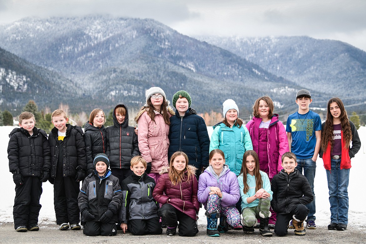 Seven sets of twins enrolled at Cayuse Prairie School on Tuesday, Jan. 24. Bottom row, left to right, Rylan and Ethan Harmon; Ingrid and Annika Scott; and Stephanie and Alex Gurtscheff. Back row, left to right, Jason and Jack Jessop; Charlie and Evan Dowell; Lily and Jack Ringhofer; Teaghan and Quora Roe; and Timber and Madisyn Williams. (Casey Kreider/Daily Inter Lake)