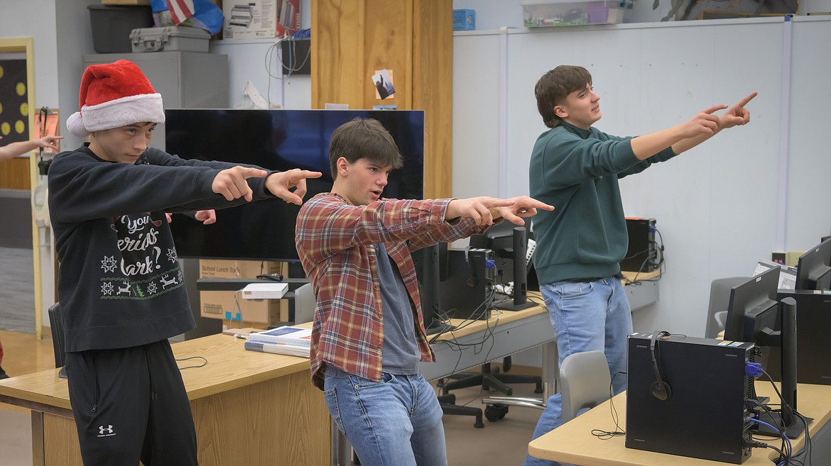 Jack Frost team members Owen Jermyn, Sam Feliksa and Konrad Maicher fine tune their dance moves at the Brain Bash. (Tracy Scott/Valley Press)