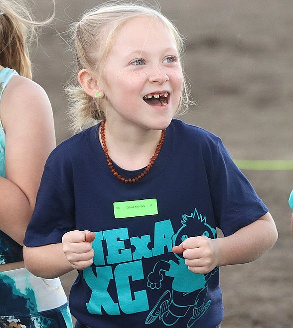 Northwest Expedition Academy Second-grader Olivia Kearbey yells before the start of her race in the Coeur d'Alene School District's annual elementary school cross country meet at the Kootenai County Fairgrounds in October.