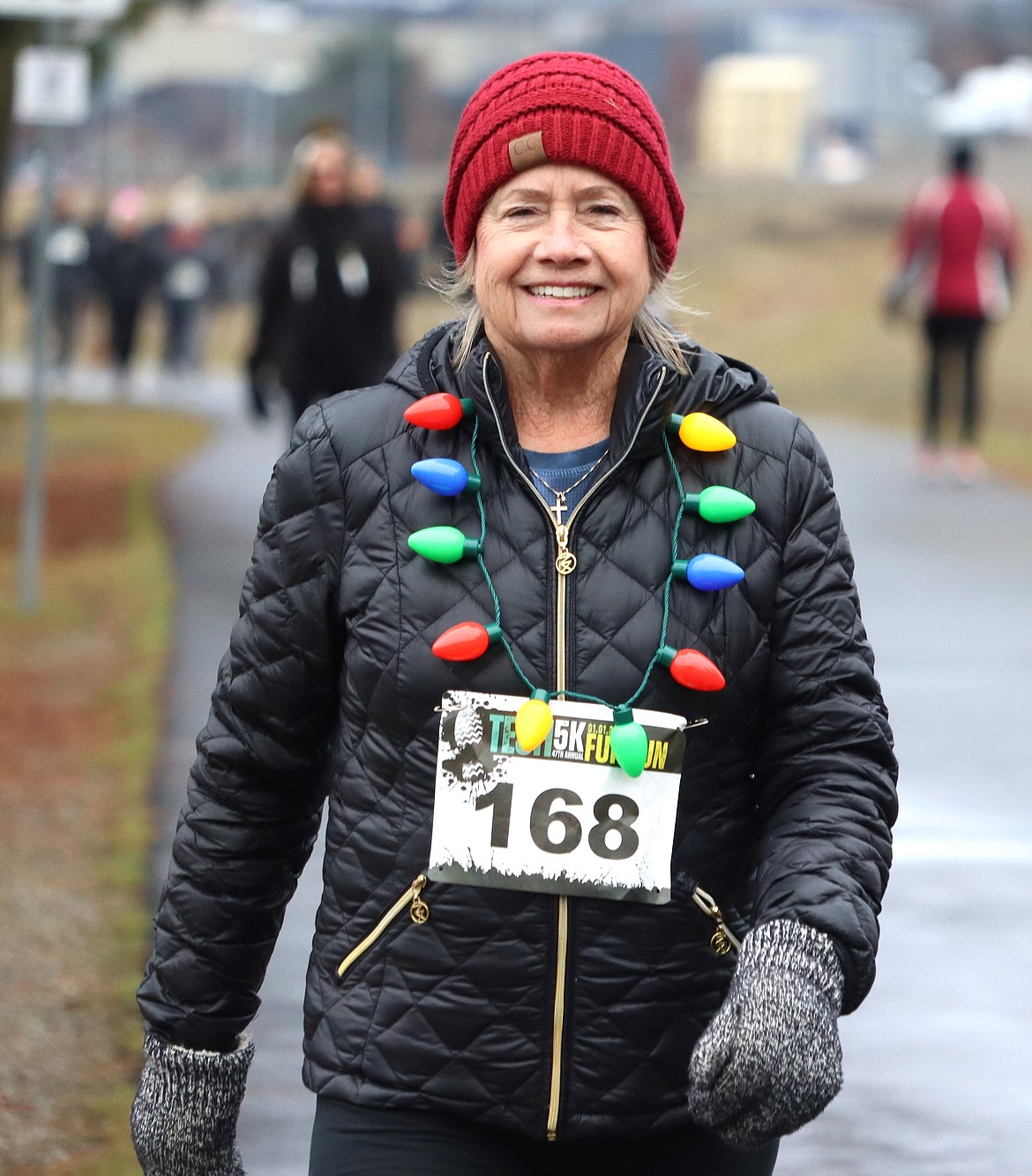 Karen Grace of Hayden smiles as she participates in the 47th annual New Year's Day fun run to benefit Tesh.