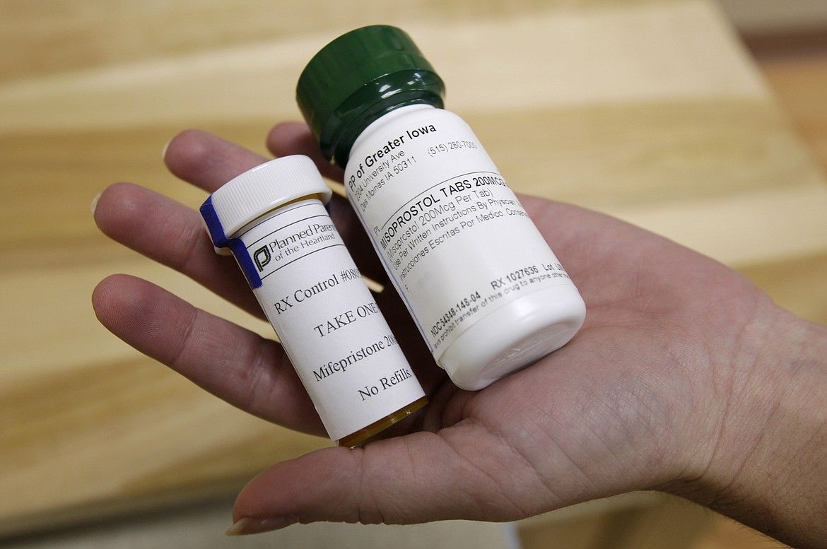 Bottles of abortion pills mifepristone, left, and misoprostol, right, are shown, Sept. 22, 2010, at a clinic in Des Moines, Iowa. Thousands of women stocked up on abortion pills just in case they needed them, according to new research published Tuesday, Jan. 2, 2024, in JAMA Internal Medicine, with demand peaking in the past couple years at times when it looked like the medications might become harder to get. (AP Photo/Charlie Neibergall, File)