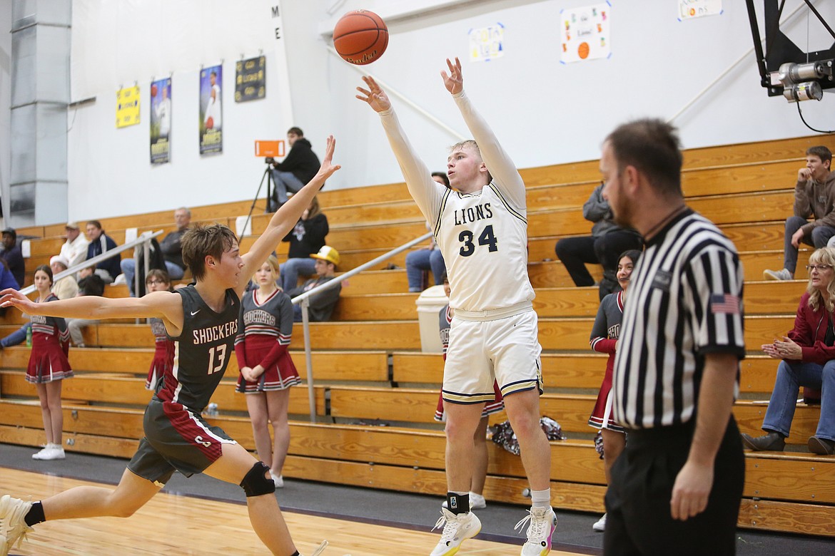 MLCA/CCS senior Jonah Robertson (34) connected on 17 three-pointers during the MLCA/CCS boys Christmas Basketball Tournament Dec. 20, hitting eight against Bridgeport and nine against Odessa. The Lions defeated both opponents to win the tournament.