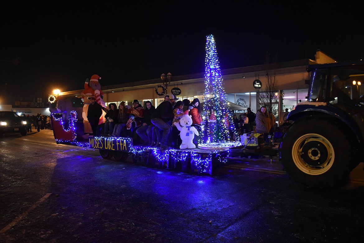 The Moses Lake Future Farmers of America float glides down Third Avenue as part of the Moses Lake Ag Appreciation Parade Dec. 1.