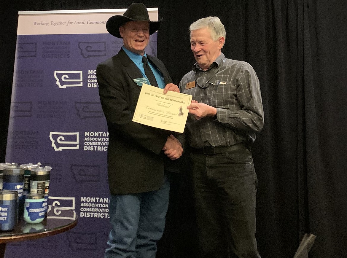 Flathead Conservation District Supervisor Roger Marsonette accepts an award from the Montana Association of Conservation Districts President Dean Rogge during the 2023 Montana Association of Conservation Districts Annual Convention. (Photo courtesy of the Flathead Conservation District.)