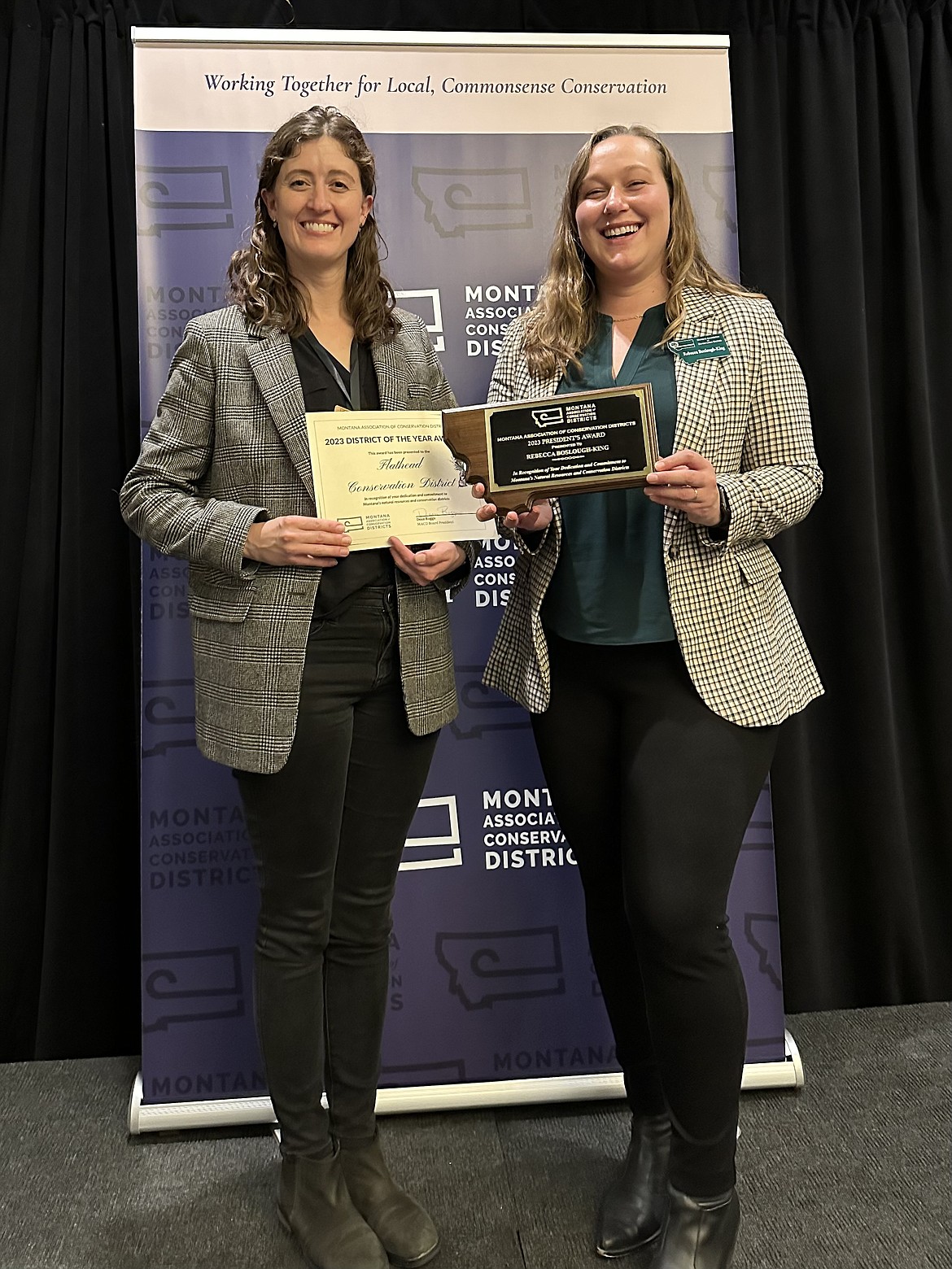 Samantha Tappenbeck, left, holds the Flathead Conservation District's award next to the Montana Association of Conservation Districts Executive Director Becca Boslough-King at the 2023 Montana Association of Conservation Districts Annual Convention. (Photo courtesy of the Flathead Conservation District.)