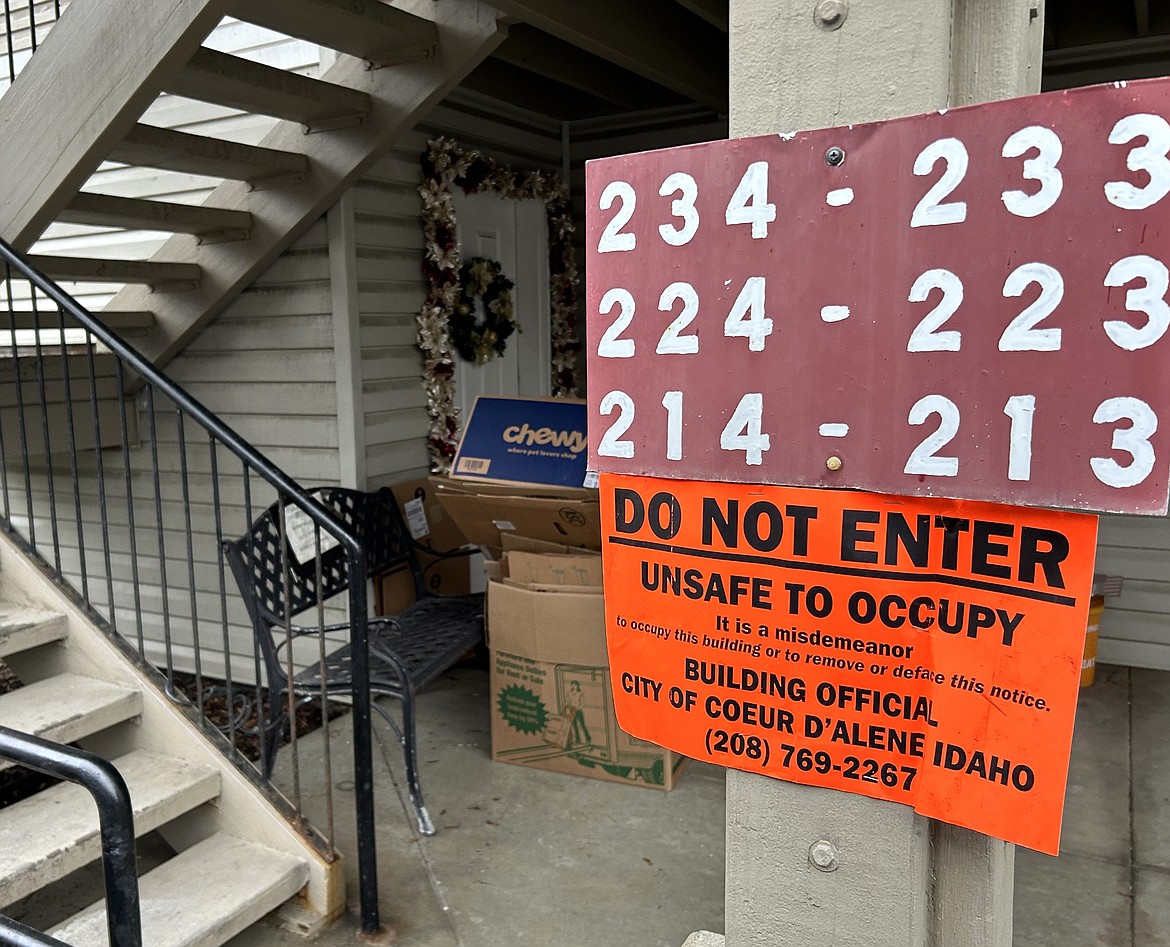 A sign posted by the city of Coeur d'Alene warns people to stay out of units damaged in a Saturday morning fire at Cherry Ridge Apartments.