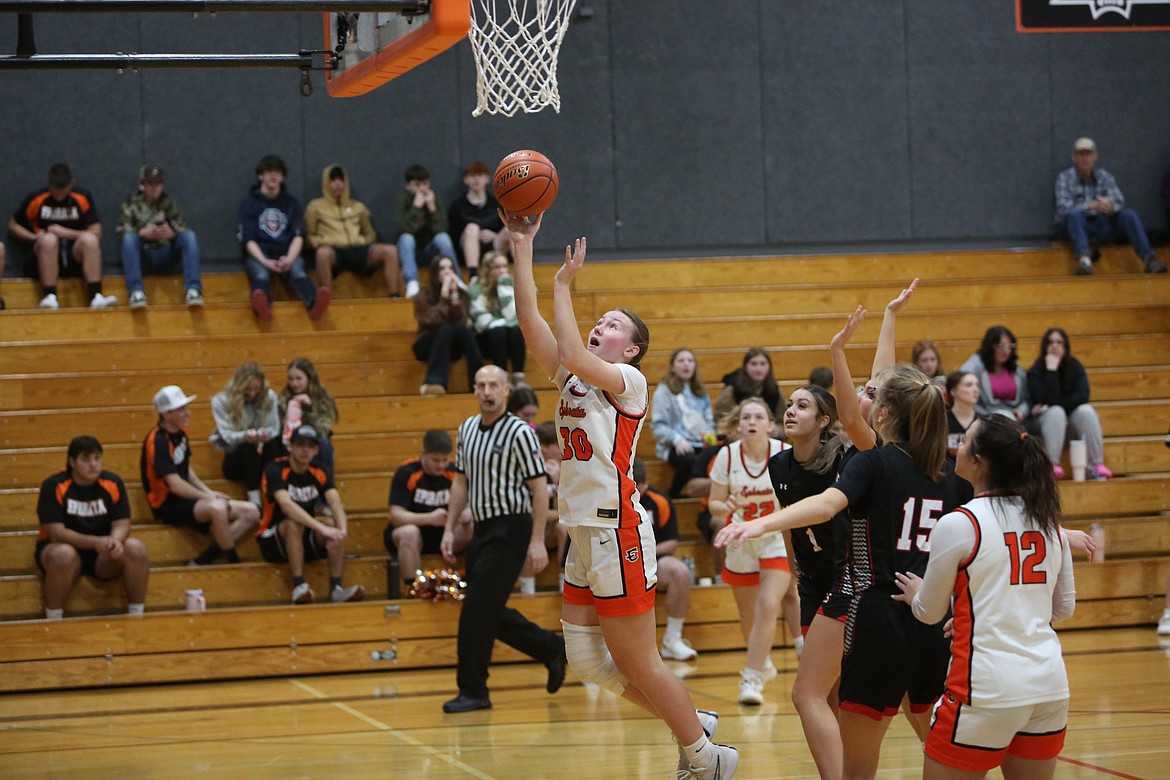 Ephrata senior Addison Mills (30) takes a shot under the rim against East Valley (Yakima) Tuesday night. Mills scored 17 points for the Tigers.