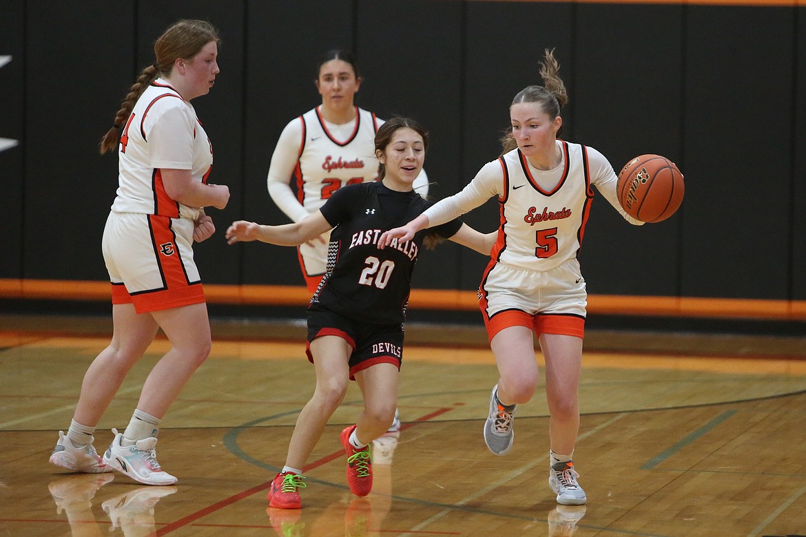 Ephrata senior Delaney Hagy (5) brings the ball up the floor against East Valley (Yakima).