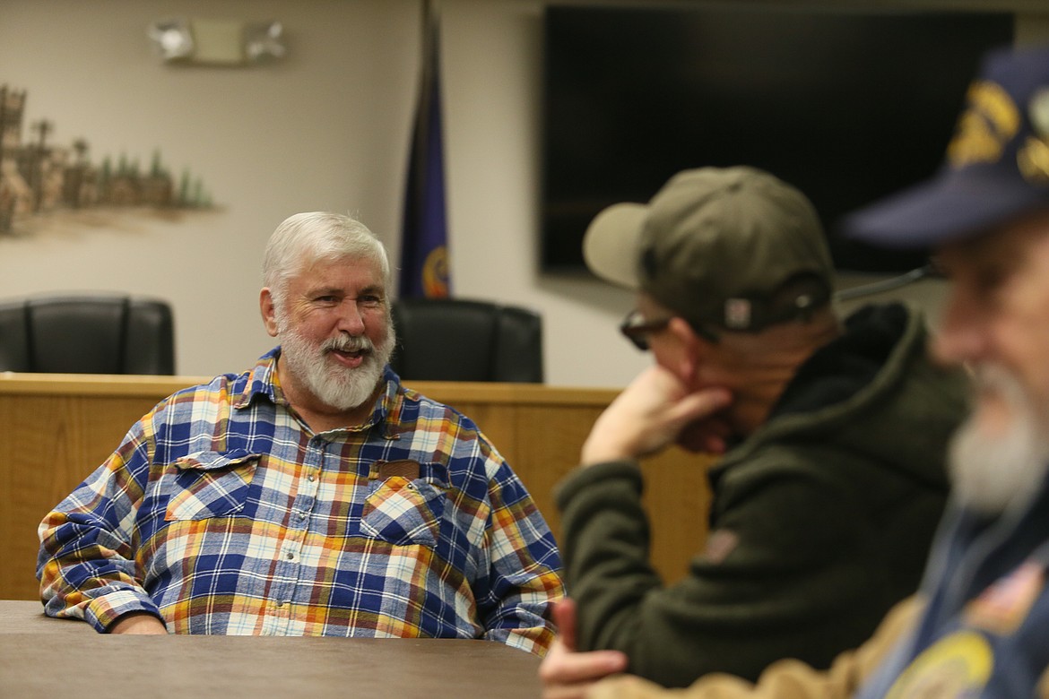 Longtime Rathdrum Mayor Vic Holmes visits with friends Wednesday during his retirement party at Rathdrum City Hall.