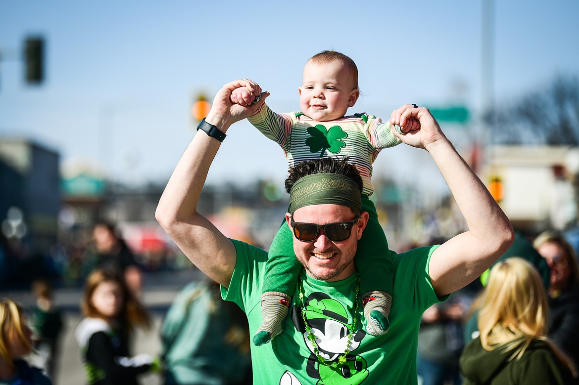 Duke Tomlinson holds his 15-month-old son Rusty on his shoulders before the start of the St. Patrick's Day Parade in Kalispell on Friday, March 17. (Casey Kreider/Daily Inter Lake)