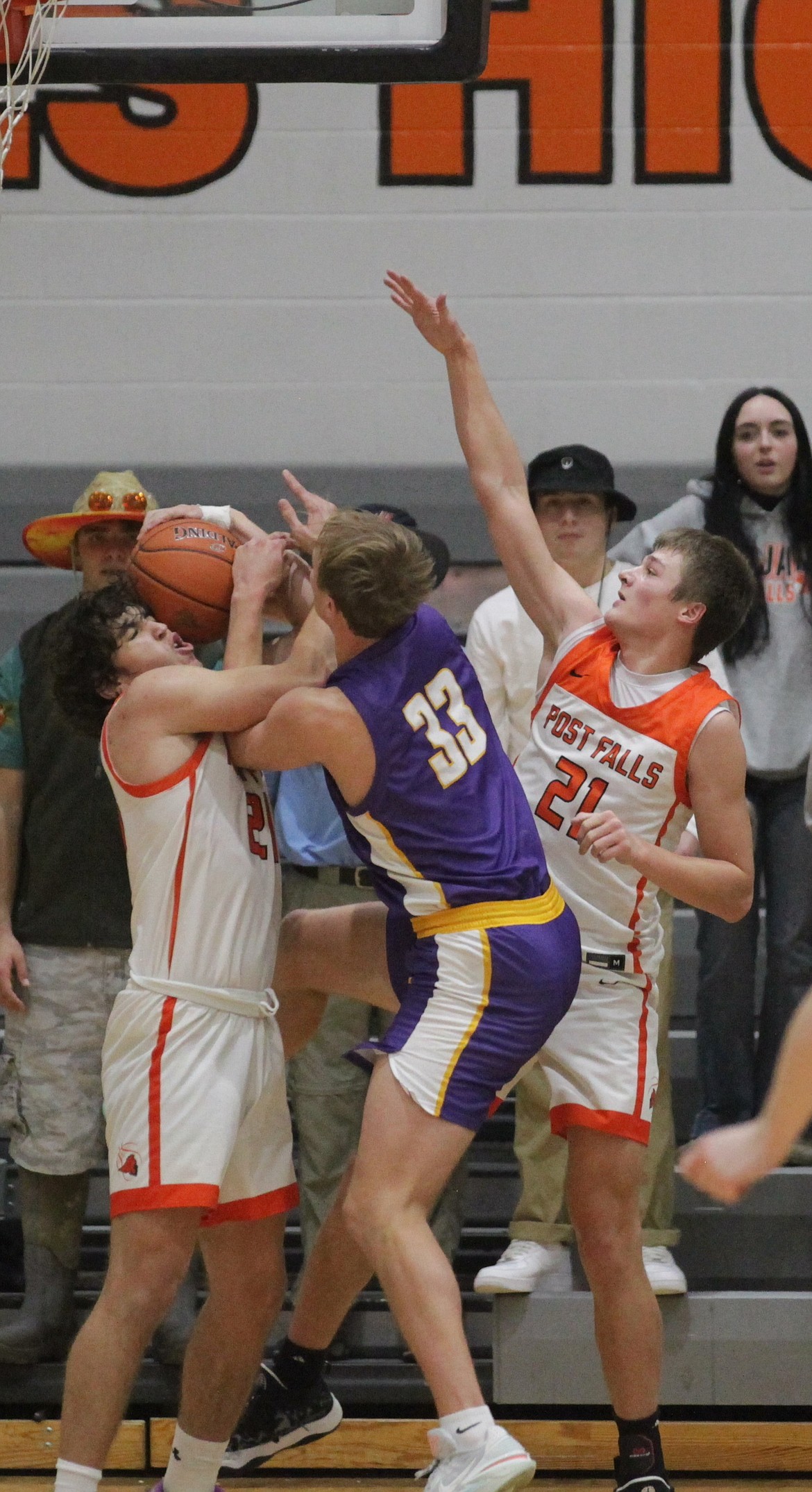 MARK NELKE/Press
Alex Shields, left, and Connor Carver of Post Falls surround Drew Hottinger of Lewiston on Friday night at The Arena.