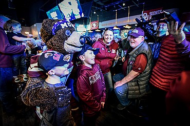 Monte takes photos with fans during a Griz Gathering held at Frisco Bar & Grill in Frisco, Texas, on Friday, Jan. 5. (Casey Kreider/Daily Inter Lake)