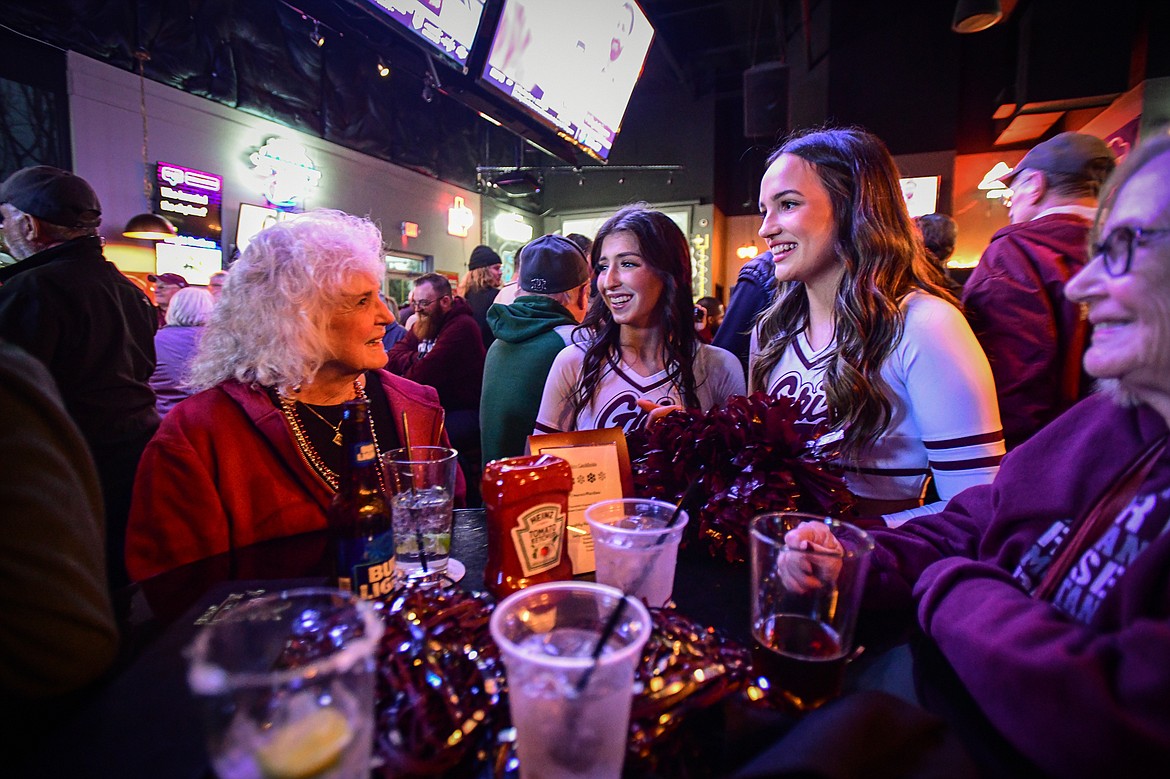 Members of the UM Spirit Squad chat with fans at a Griz Gathering at Frisco Bar & Grill in Frisco, Texas, on Friday, Jan. 5. (Casey Kreider/Daily Inter Lake)